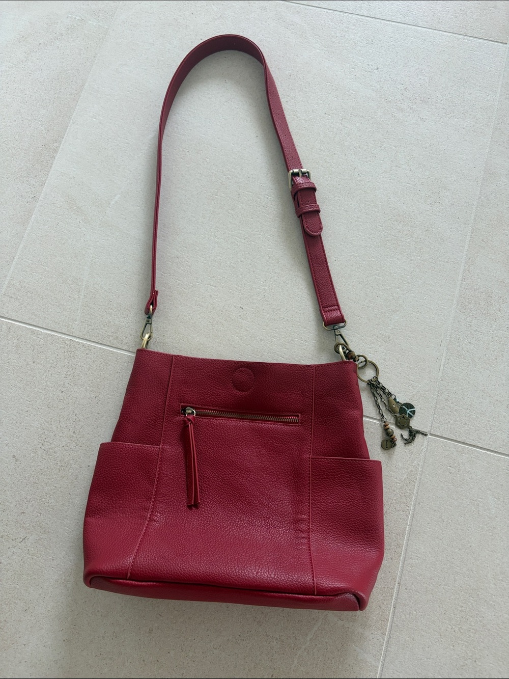 The Sak Red Pebbled Leather Shoulder Bag with Charm Detail